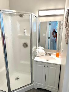 a bathroom with a shower and a sink at Lovely Renovated 1Bdrm 1Bath Getaway in Ocean City