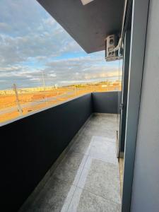 an empty balcony with a view of an airport at Riacho HOTEL in Brasília