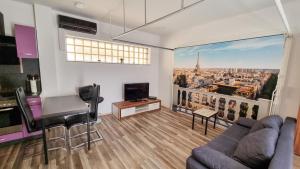 a living room with a view of the eiffel tower at Bungalow Alex in Dresden