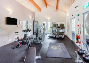 a gym with several exercise bikes in a room at Bath Mill Lodge Retreat in Bath