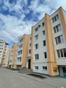 a row of tall apartment buildings on a street at Mark House 4 in Căuşeni