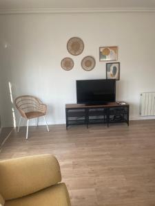 A television and/or entertainment centre at AT SAN MIGUEL o
