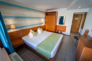 Postel nebo postele na pokoji v ubytování Hotel Apollo