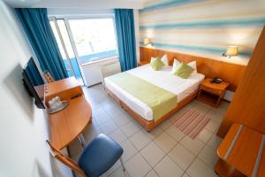Postel nebo postele na pokoji v ubytování Hotel Apollo