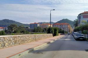 a street with cars parked on the side of the road at Apartamento Lekeitio, Garaje y WIFI in Lekeitio