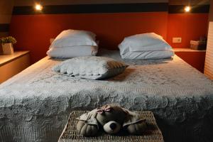 Säng eller sängar i ett rum på MARGOT'L