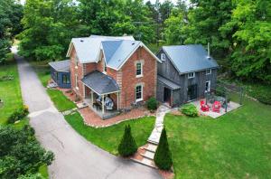 an aerial view of a large brick house at A rustic cabin in the woods in Orangeville