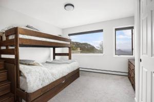 a bedroom with a bunk bed and a window at Beautiful View Point Villa in Conifer