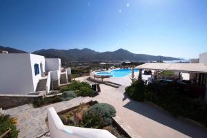 a view of a resort with a swimming pool at Amorgion Village in Katapola