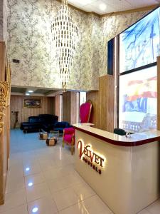 a lobby with a yer hotel sign on the wall at Velvet Hostels in Madrid