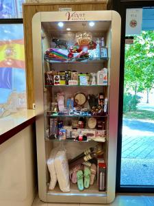 a refrigerator filled with lots of food at Velvet Hostels in Madrid