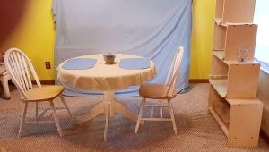 a table and chairs in a room with a tent at Sandie's Country Bed and Bath in Chiefland