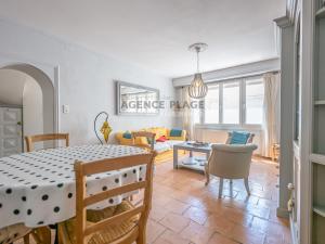 a dining room and living room with a table and chairs at Maison 3 chambres, accès plage direct, proche centre et commerces - FR-1-197-550 in Les Sables-dʼOlonne