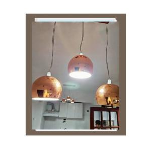 two large pendant lights hanging from the ceiling of a kitchen at Alojamiento Patagonia centro in Viedma