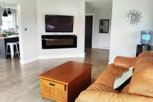 a living room with a couch and a coffee table at Coco home in Charlottetown