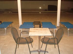 a group of tables and chairs in a room at Villa Lara in Polignano a Mare