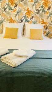 Ένα ή περισσότερα κρεβάτια σε δωμάτιο στο Le bastidon - Fontvieille
