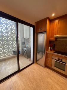 a kitchen with a sliding glass door leading to a kitchen at Atlantic Magna in Tangier