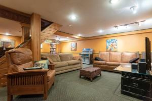 a living room with couches and a staircase at Eagle Nest Cozy Studio in Andes