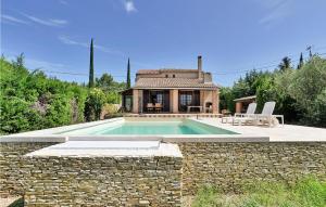 a house with a swimming pool and a stone wall at Amazing Home In Saint-pierre-de-vassol With Outdoor Swimming Pool in Saint-Pierre-de-Vassols