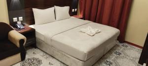 Postel nebo postele na pokoji v ubytování Tehran Hotel