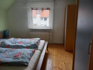 a room with two beds and a window at WALLA 10351145 in Lippoldsberg