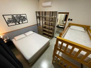 Cantinho Estrelado - Casa automatizada com ALEXA客房内的一张或多张床位