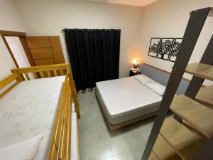 Cantinho Estrelado - Casa automatizada com ALEXA客房内的一张或多张床位