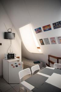 Televízia a/alebo spoločenská miestnosť v ubytovaní C2 apartman