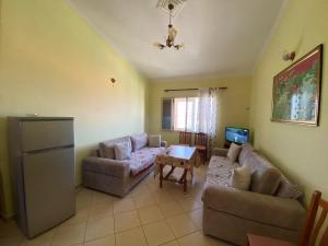 a living room with two couches and a table at Alti Holiday Apartments ONE in Orikum