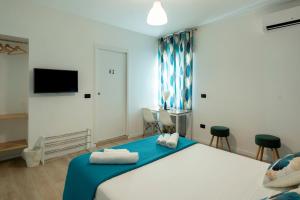 Postel nebo postele na pokoji v ubytování B&B Villa Pignataro