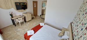 TV a/nebo společenská místnost v ubytování OITUZ Boutique Residence