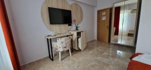 TV a/nebo společenská místnost v ubytování OITUZ Boutique Residence