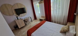 TV a/nebo společenská místnost v ubytování OITUZ Boutique Residence