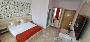 Postel nebo postele na pokoji v ubytování OITUZ Boutique Residence