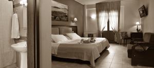 Postel nebo postele na pokoji v ubytování Hotel Pelion Resort