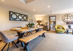 a dining room with a table and chairs at Camlad Barn in Chirbury