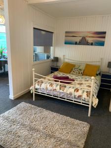 a bedroom with a bed and a window at Silverspring Hideaways in Constantine
