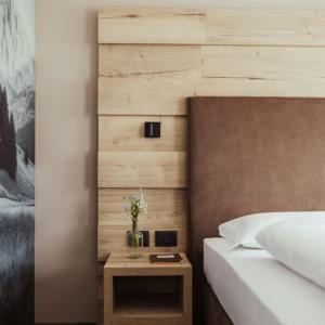 Postel nebo postele na pokoji v ubytování Hotel Leonard