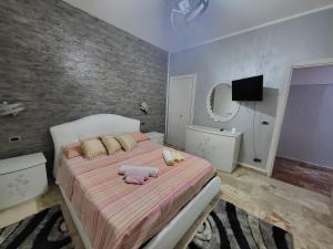 Un pat sau paturi într-o cameră la Appartamento Mariarita