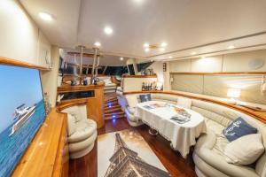 a large room with a couch and a table in a boat at MR.ATEŞ in Antalya
