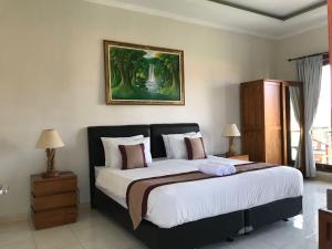 Ένα ή περισσότερα κρεβάτια σε δωμάτιο στο Surya Guest House Sanur +89 φωτογραφίες