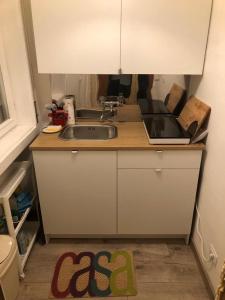 a kitchen with a sink and a counter top at Monovano Elllen in Grado