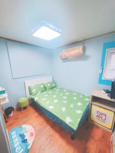 a bedroom with a bed in a toy room at Naru Hostel Korea in Seoul