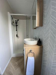 a bathroom with a sink and a white towel at Perfect for country lovers in Grantown on Spey