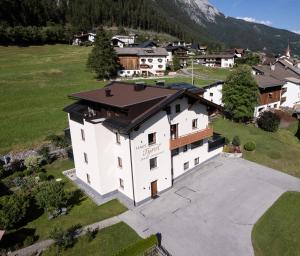 an aerial view of a building in a village at Appartements Tyrol in Pettneu am Arlberg