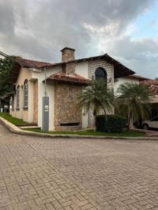 a house with a brick road in front of it at Casa dentro del Campo de Golf in Comayagua +19 photos