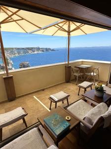 a living room with a view of the ocean at Entre Ciel et Mer in Bonifacio