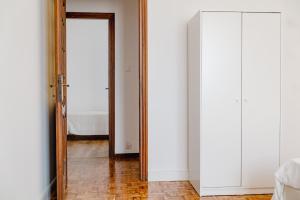 a hallway with a door and a mirror at ShortMi Balilla in Milan