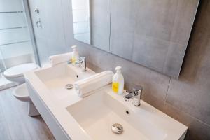 a bathroom with a white sink and a mirror at ShortMi Balilla in Milan